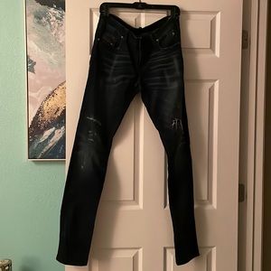 Diesel Jog Jean- Grupee Fit. Distressed blue, cowhide leather details.